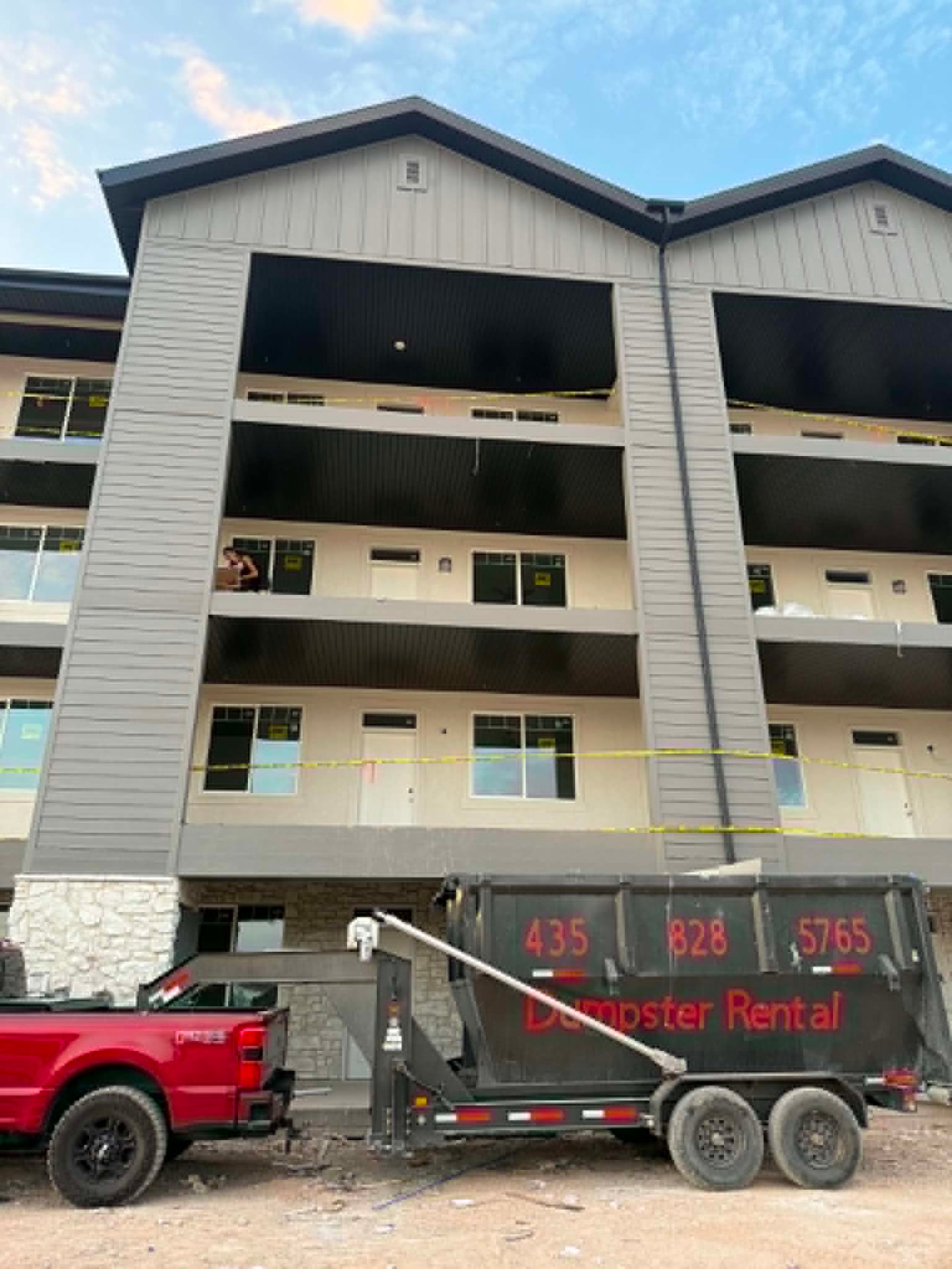 Outlaw Willy's 20-yard dumpster trailer parked at an apartment construction site